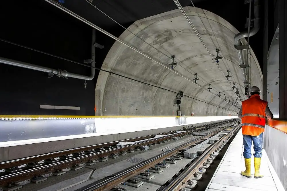 Construction Man working in railway tunnel on construction project.